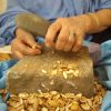 Berber Woman Cracking Argan Nuts in Morocco