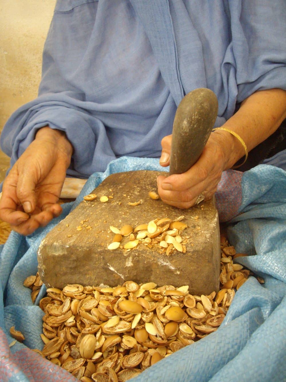 Berber Woman Cracking Argan Nuts in Morocco 2012