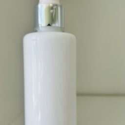 White Opaque cosmetic glass bottle with silver pump 4oz